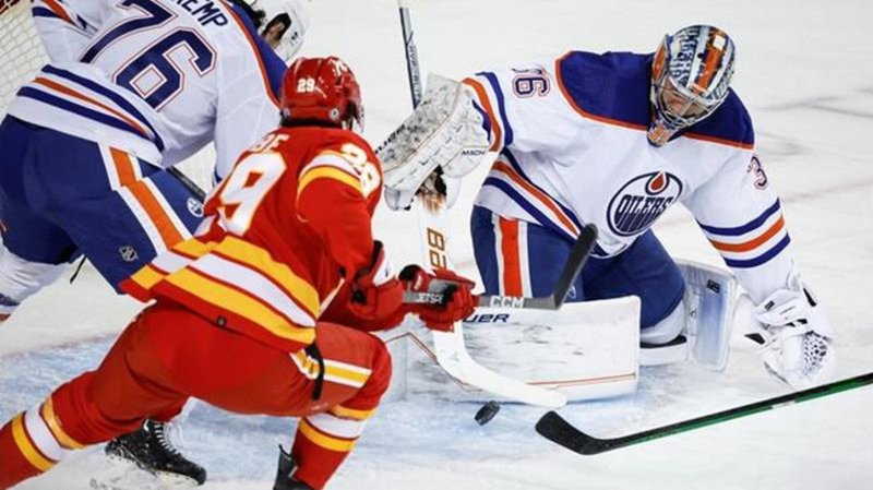 Malone scores in OT as Oilers rally to beat Flames 2-1